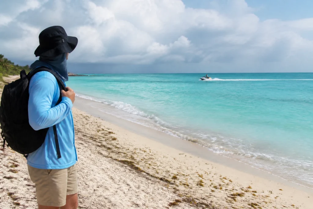 Traveler checking beach conditions before a water activity