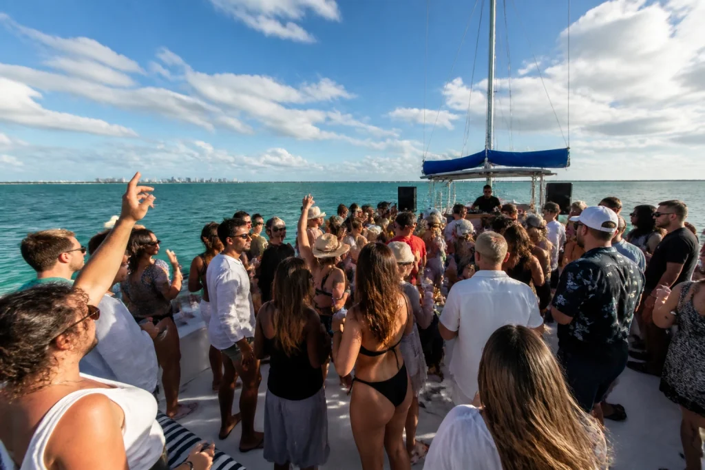 Guests on the deck of a Cancun catamaran during an afternoon cruise
