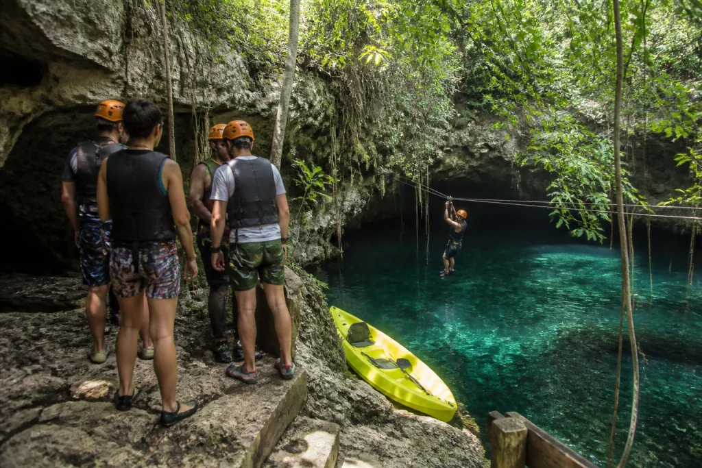 Travelers preparing for guided activities during a cenote tour