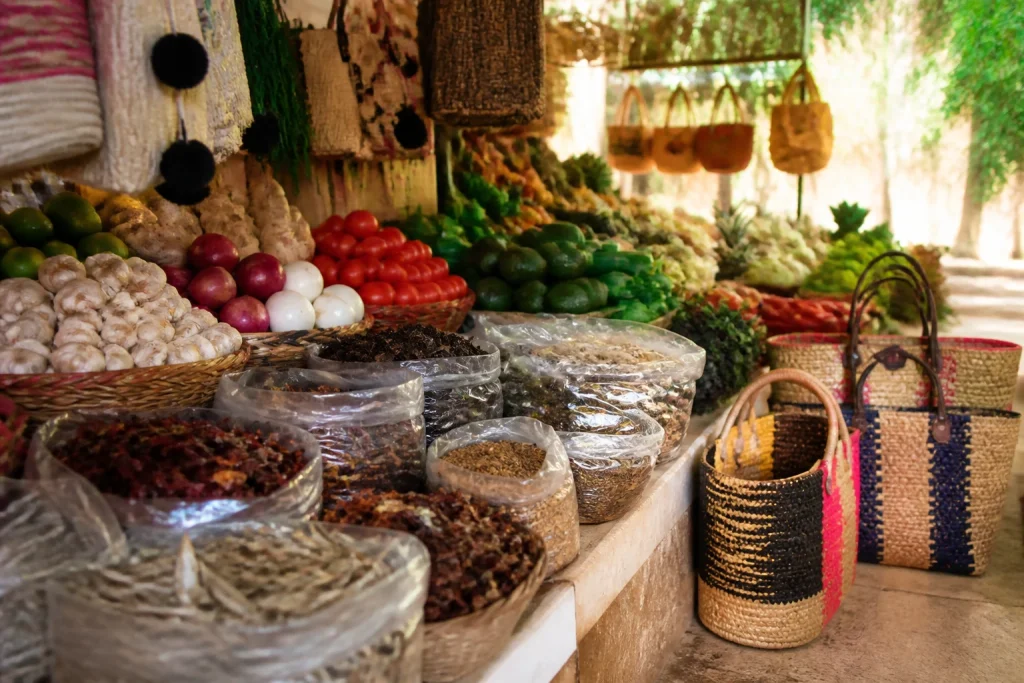 Produce and spices arranged at a Cancun market counter