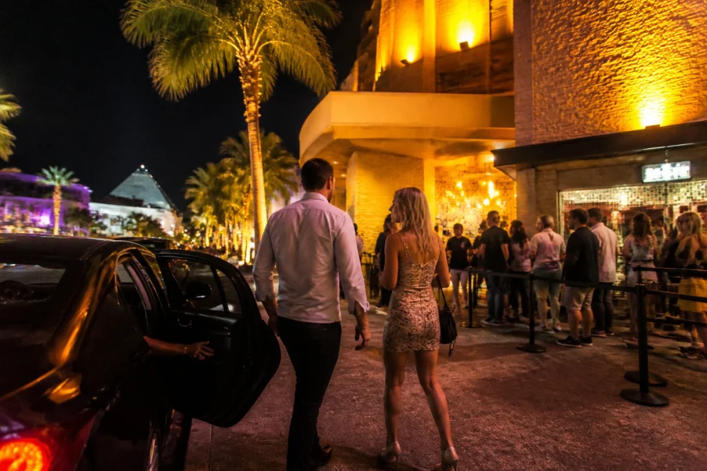 Visitors arriving by taxi for a Cancun Hotel Zone evening