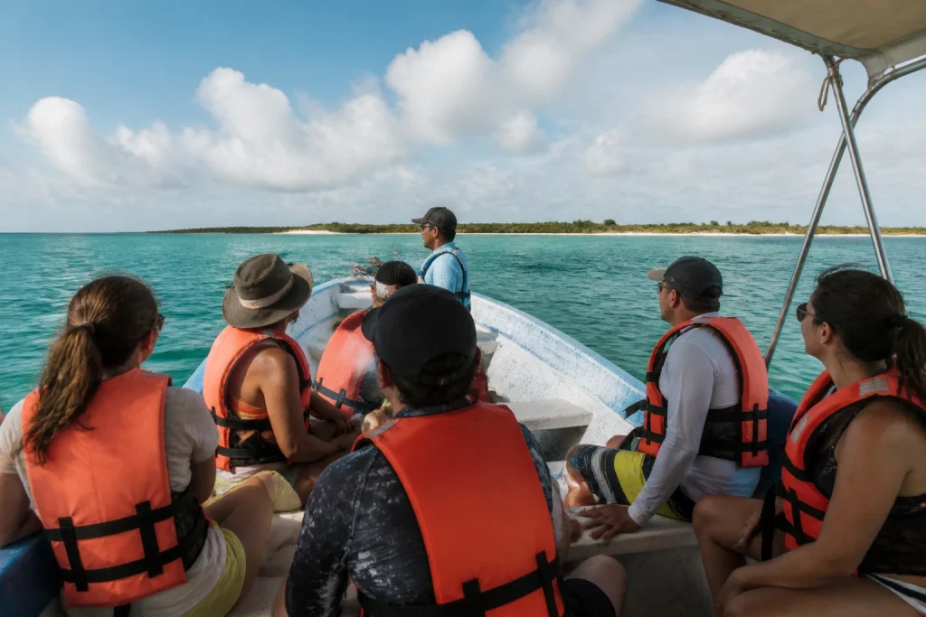 Small group on a boat during a whale shark excursion near Isla Contoy